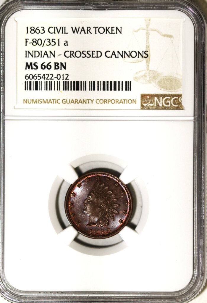 1863 CIVIL WAR TOKEN F-80/351a INDIAN -CROSSED CANNONS NGC MS 66 BROWN